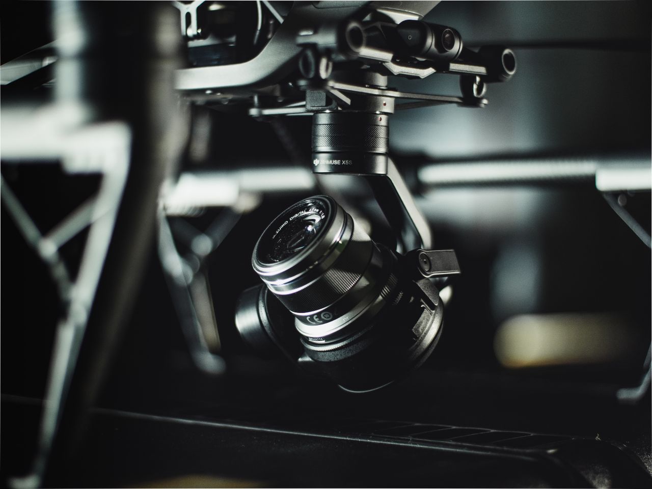 A professional cinema camera drone gimbal and lens in close-up