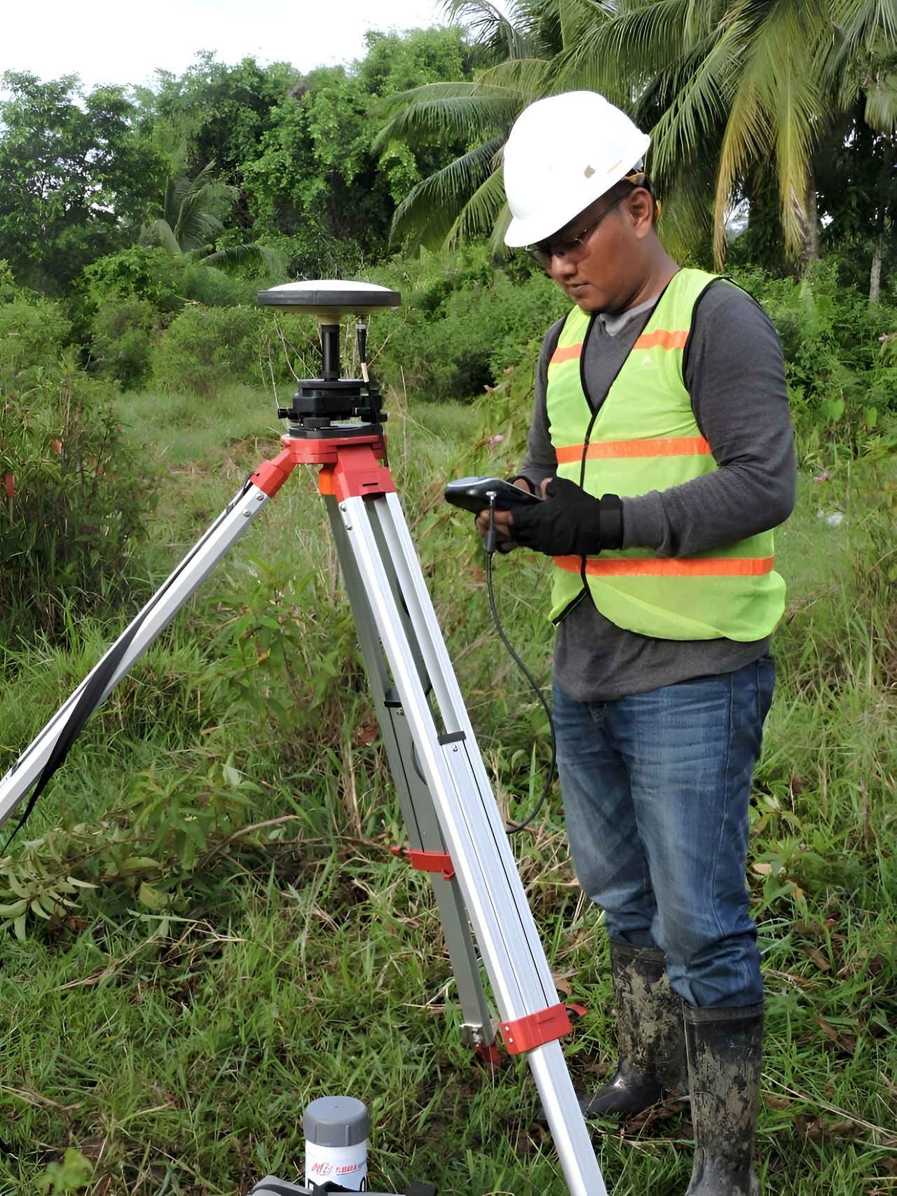 A survey crew with field instruments on a site